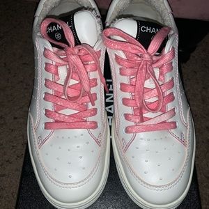 Pink and white Chanel tennis shoes